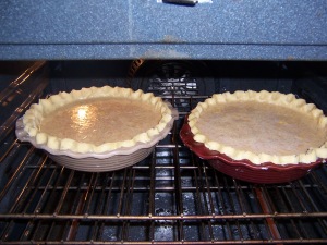 2 delicious pumpkin pies ready to be baked and sent off to love someone!